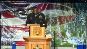 Military officer speaking at Memorial Day event