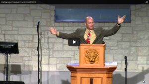 Speaker delivering sermon at church pulpit