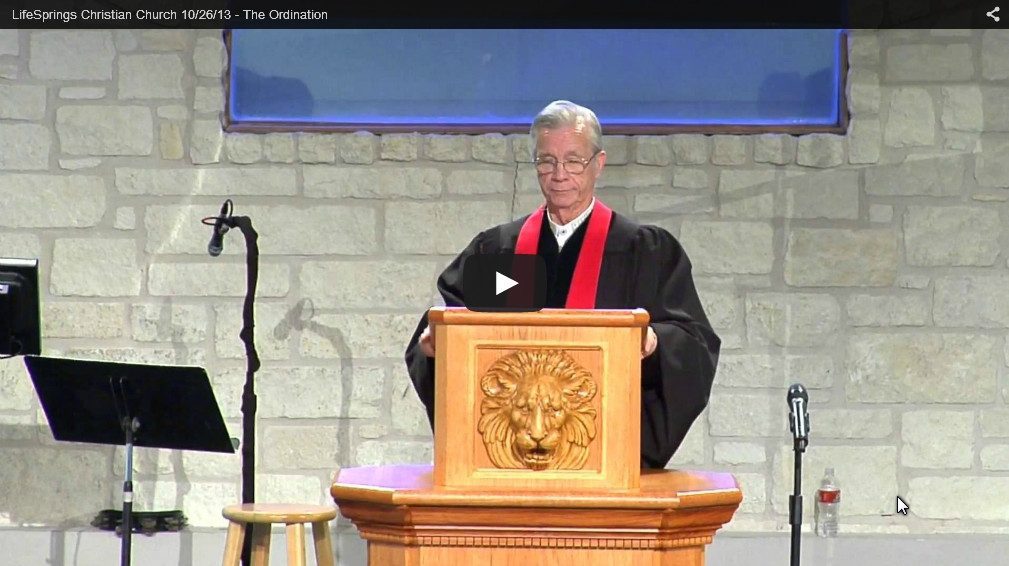 Man speaking at church podium during service.