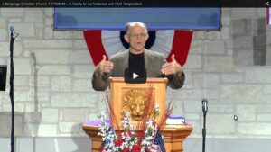 Man speaking at religious ceremony with podium