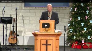 Pastor delivering sermon at decorated church altar