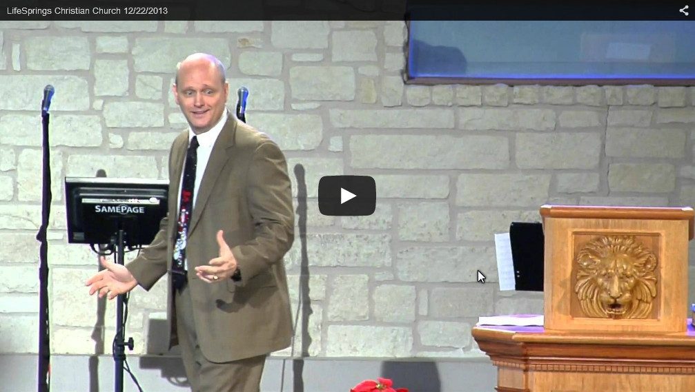 Man speaking at church podium during service