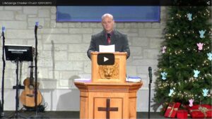 Man speaking at church during holiday service