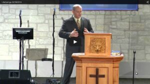 Man delivering a speech at church podium