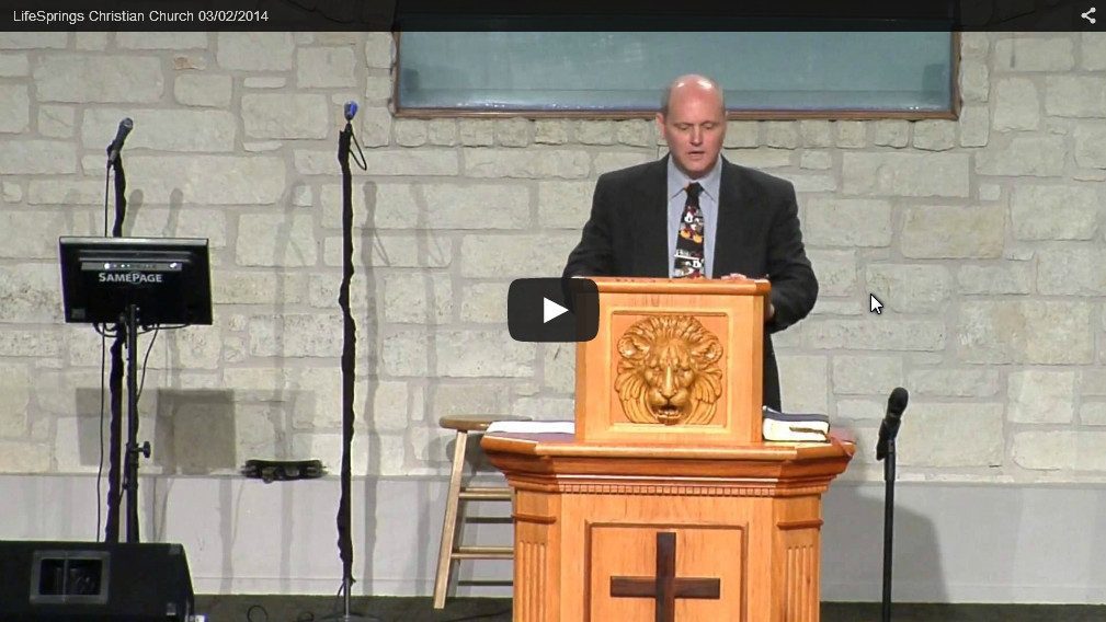 Man speaking at church podium during service