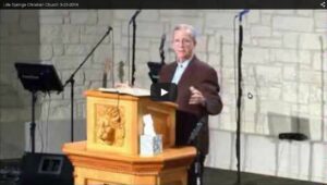 Pastor delivering sermon at church podium