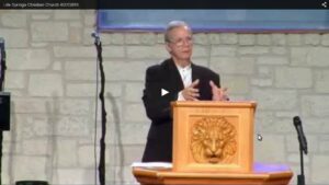 Pastor delivering sermon at church podium