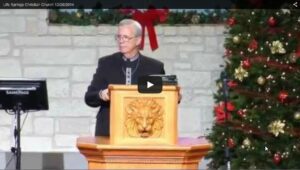 Speaker at church podium during Christmas service