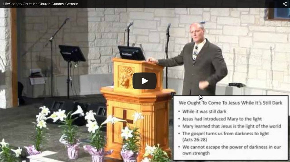 Pastor delivering sermon at church podium stage