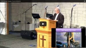 Pastor delivering sermon at church podium