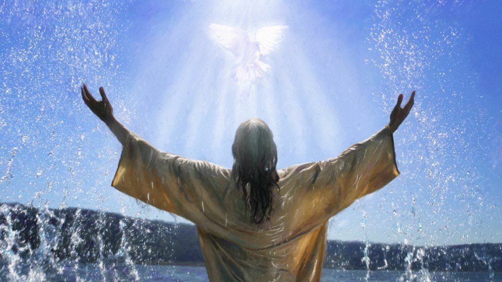 Person stands in water with radiant light.