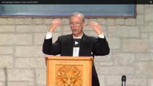 Speaker at podium during church service sermon