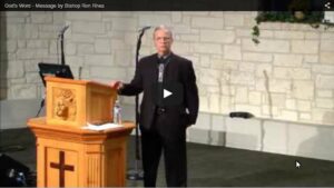 Man delivering a sermon at a podium