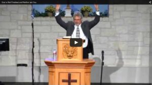 Preacher delivering sermon at a church podium.