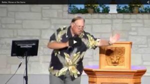 Man giving a lecture at a podium