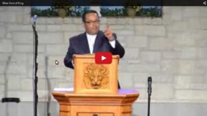 Person speaking at church podium during sermon