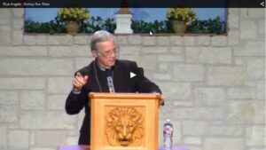 Man speaking at podium during church service