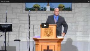 Pastor delivering sermon at church podium indoors