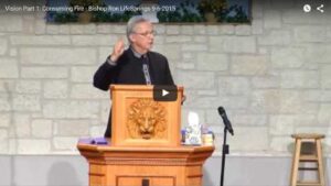 Speaker delivering sermon at church podium