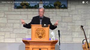 Man giving sermon at Christian church podium