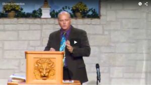 Man speaking at church podium during sermon