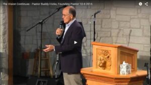 Man speaking at church podium during sermon