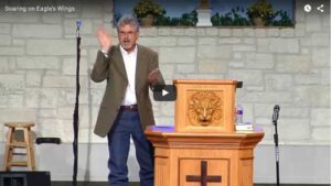 Speaker delivering lecture at church podium