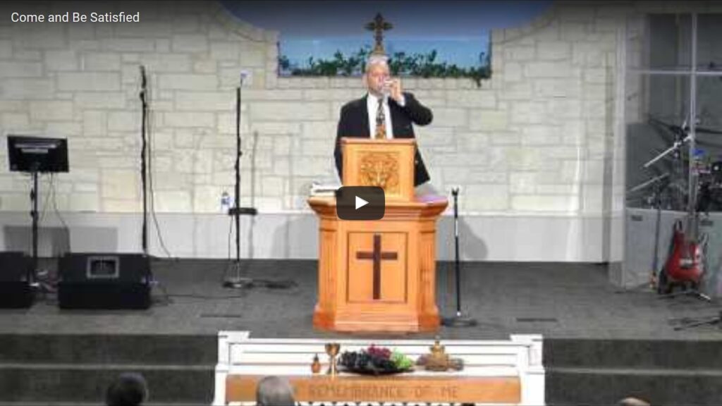 Preacher delivering sermon at church podium