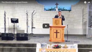 Pastor preaching at church podium during service