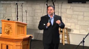 Man giving speech in a church setting