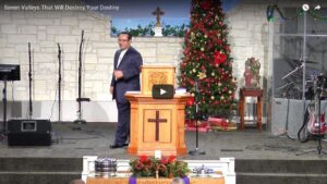 Church sermon with Christmas decorations and pastor