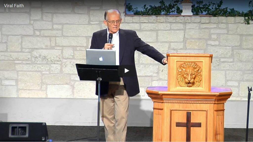 Man speaking at podium in church setting