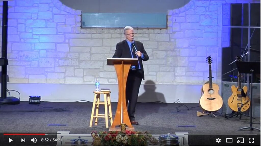 Speaker giving a presentation at a church.