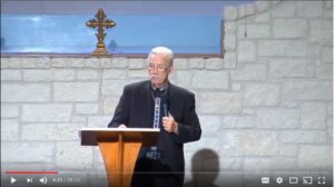 Speaker giving a lecture in a church setting