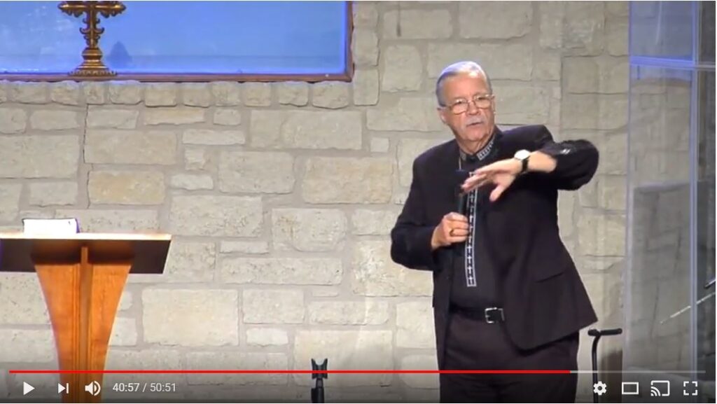 Man delivering speech in church setting video.