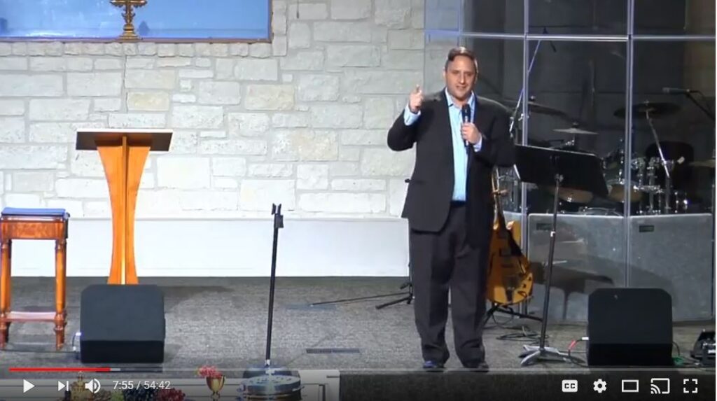 Speaker presenting at a church podium event