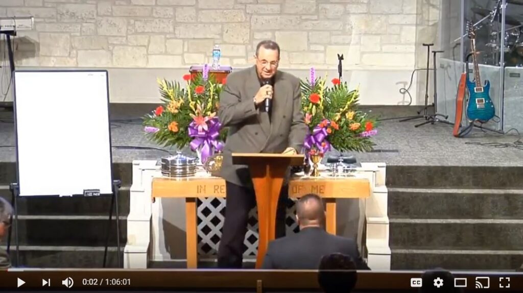 Pastor delivering sermon at church podium service