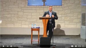 Person speaking at a podium in church