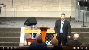 Speaker addressing audience in a church setting