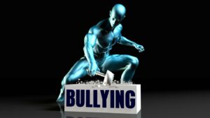 Figure smashing bullying block with hammer impact