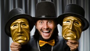 Man holding theatrical masks with expressions