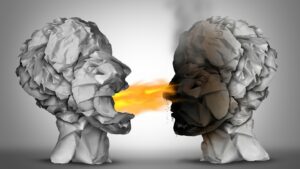 Two paper heads arguing with flames between.