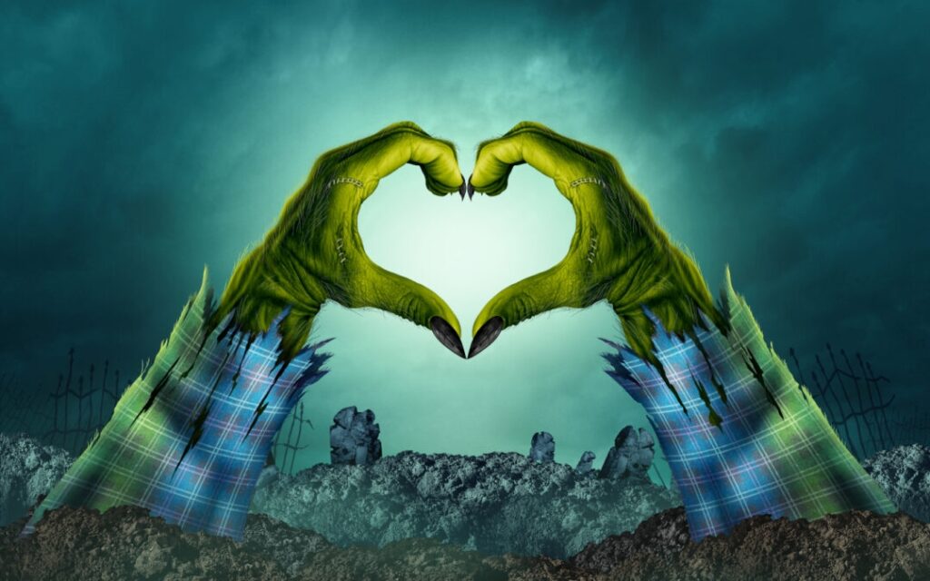 Zombie hands forming heart in graveyard setting