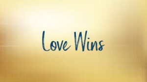 Text saying Love Wins on golden background