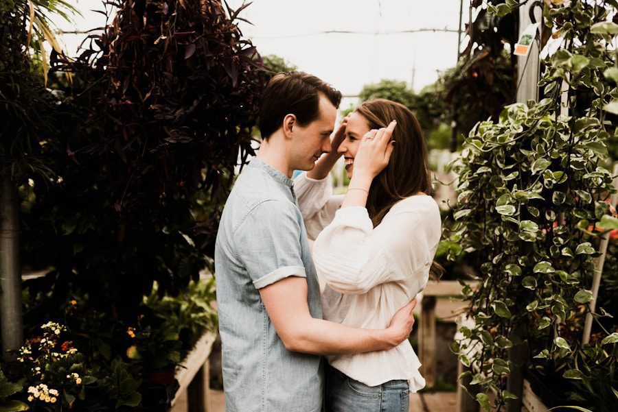 Couple embracing in a lush garden setting