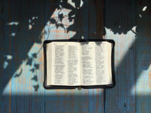 Open book on rustic wooden table.