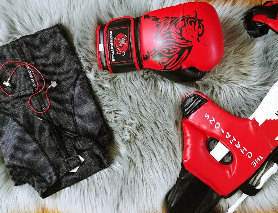 Boxing gear and gym clothing on rug