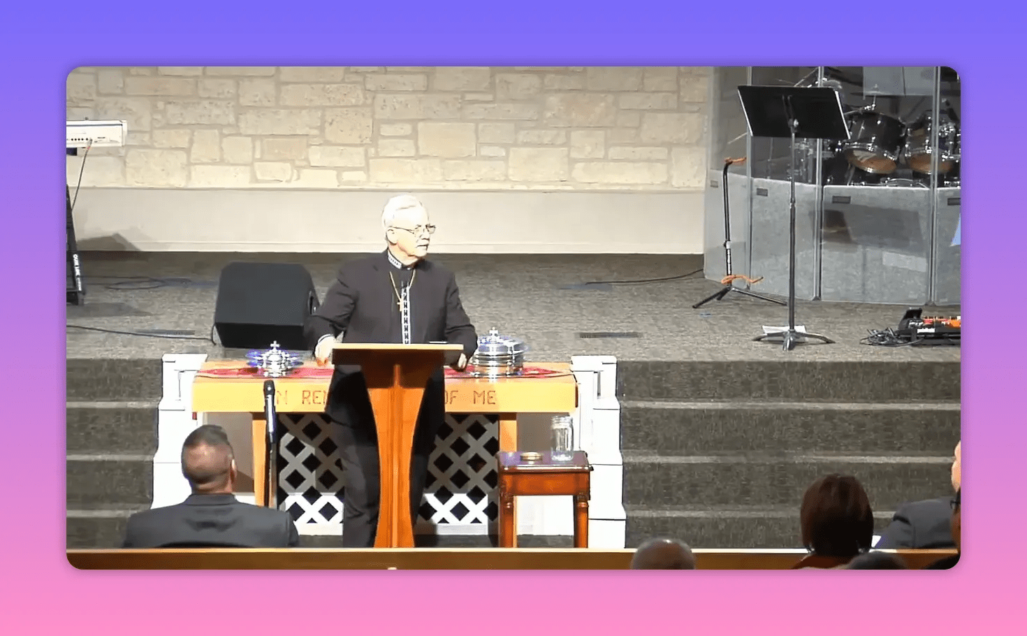 speaker at pulpit gesturing while teaching about freedom in Christ