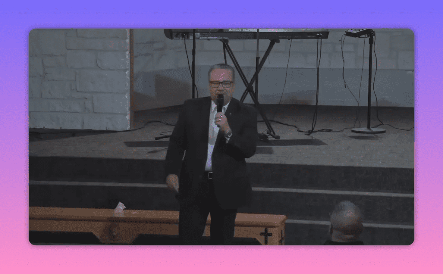 Pastor speaking directly to the congregation about trusting God