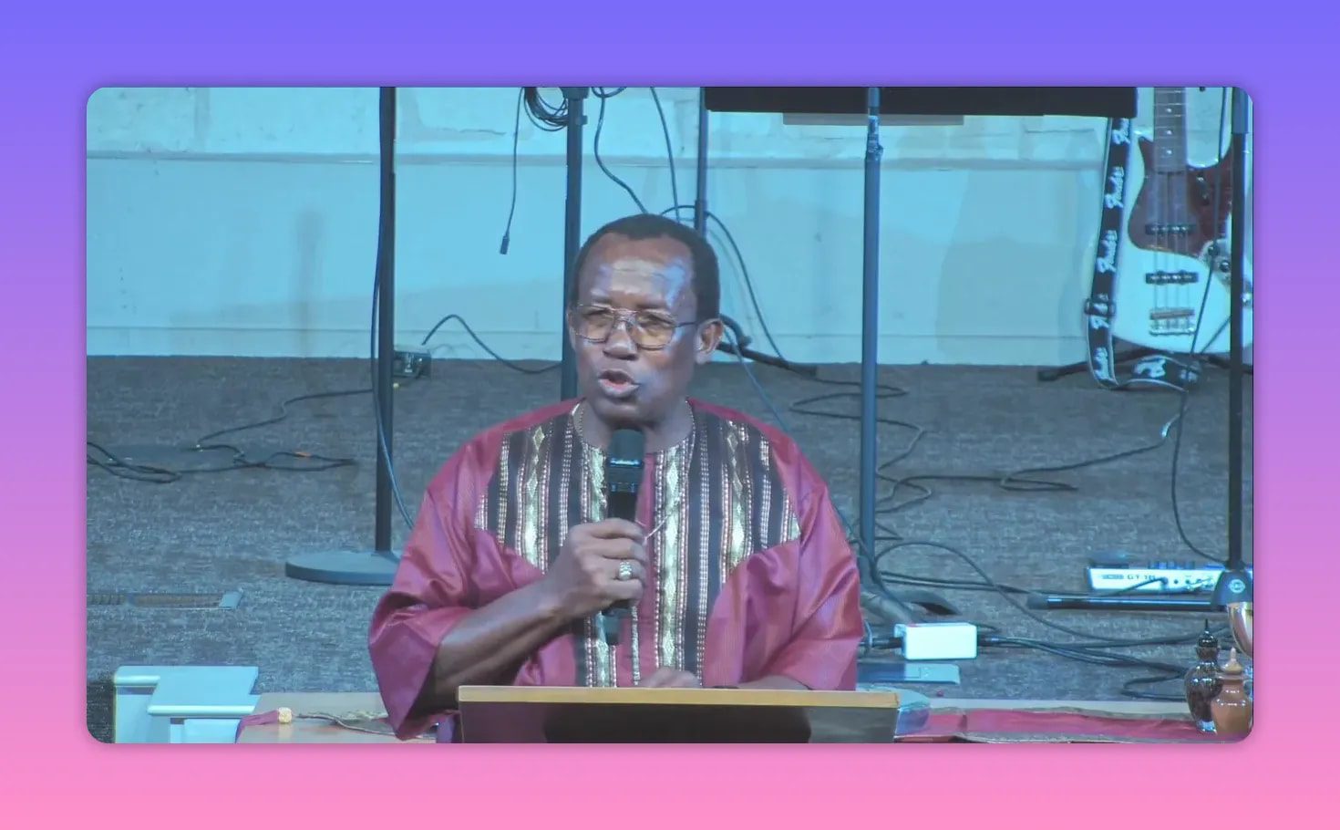 Church preacher speaking at a lectern with microphone during a sermon closing challenge to break free